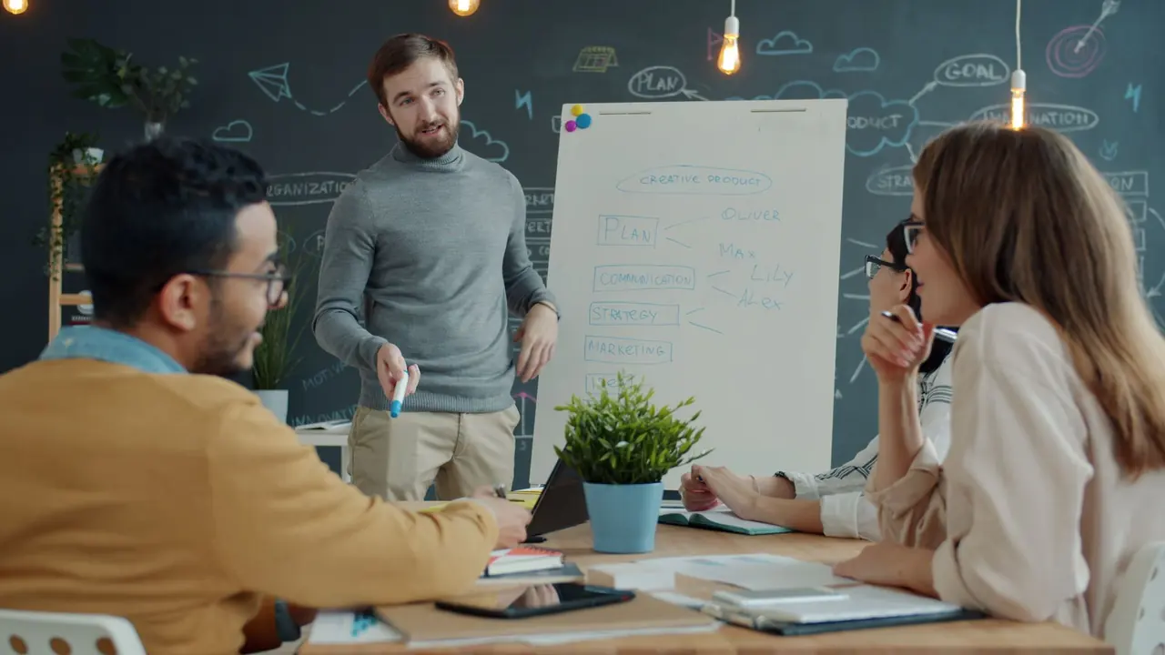 A team reviewing strategy notes on a whiteboard during a planning session