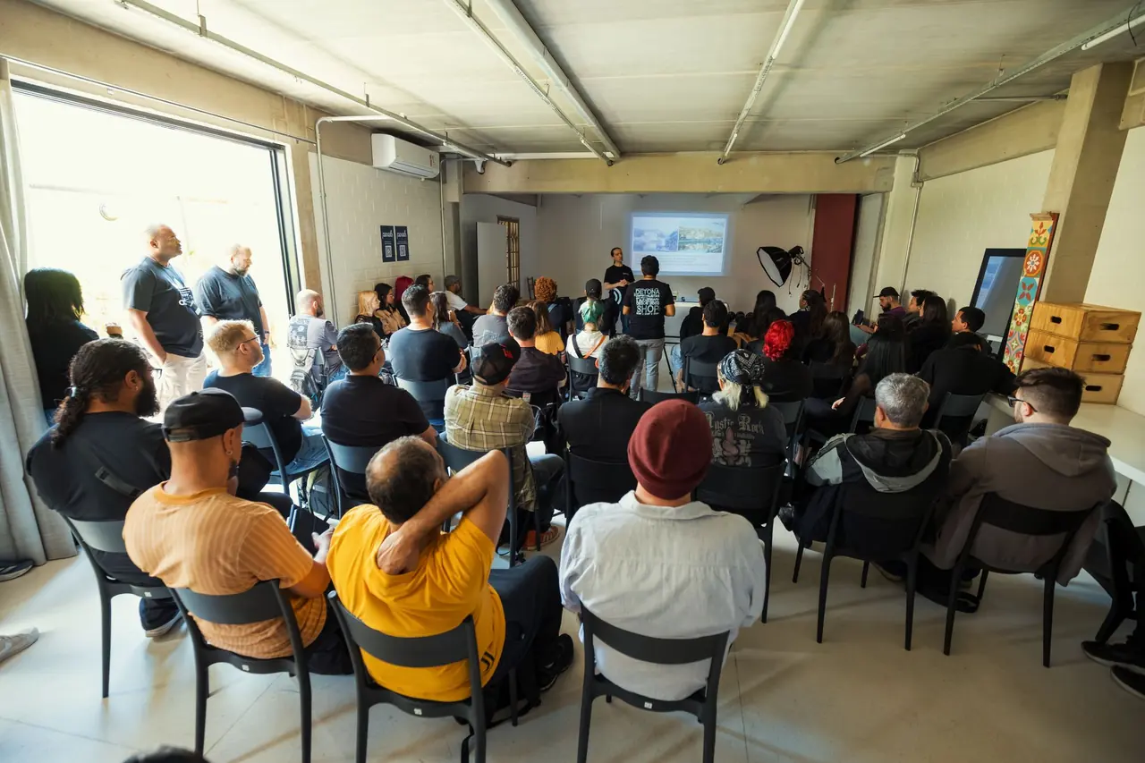 An audience listening to a presentation at a community meeting