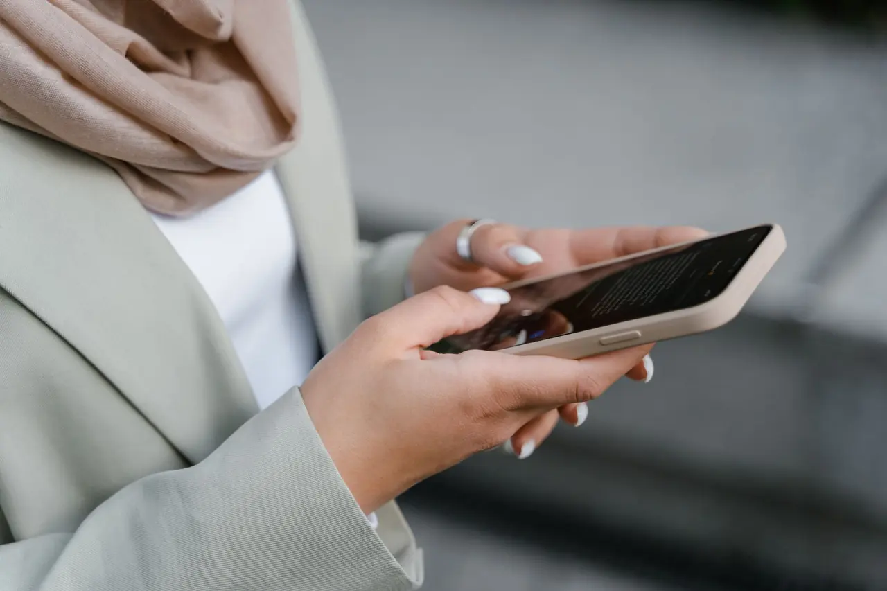 A woman checking social media on her smartphone
